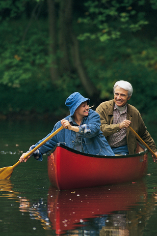 Elderly couple canoeing