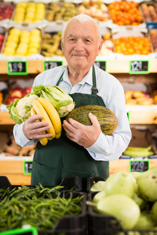Elderly gentleman working in the produce department