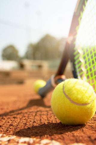 Tennis ball, racquet and net