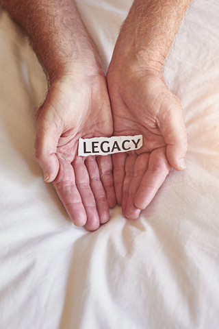 Hands holding their word 'legacy'