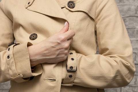 a close up of a camel colored waterproof raincoat