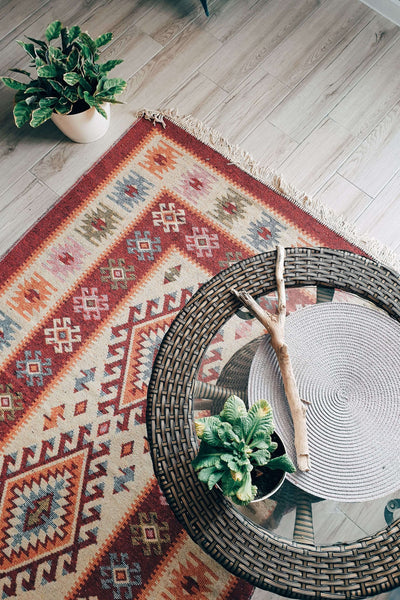 Flat weave rug underneath a table