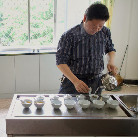 Ye Hanzhong pouring a flight of teas to taste
