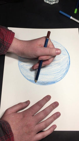 Applying a darker layer with blue watercolor pencil to paint Mercury planet