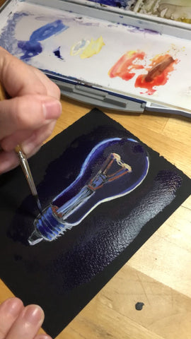 sharpening the light lines using dark purple and blue paint for metallic lightbulb parts