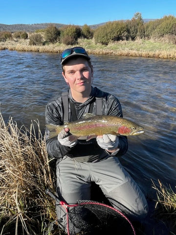 Cameron with a solid river fish