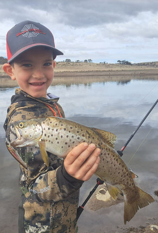 Max Baxter with his first lure caught fish & first ever Brown Trout.