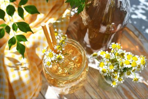 Chamomile tea with ice cream cubes and flowers