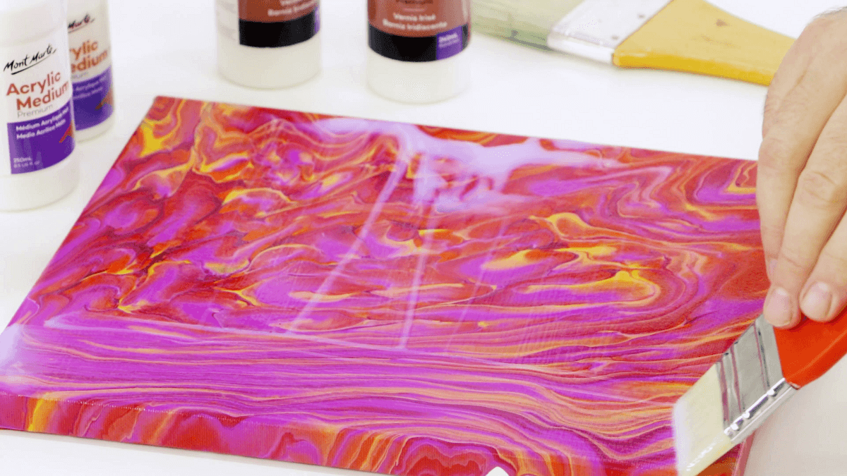 A 60's mod-style pink artwork with a hand varnishing the artwork using a red brush.