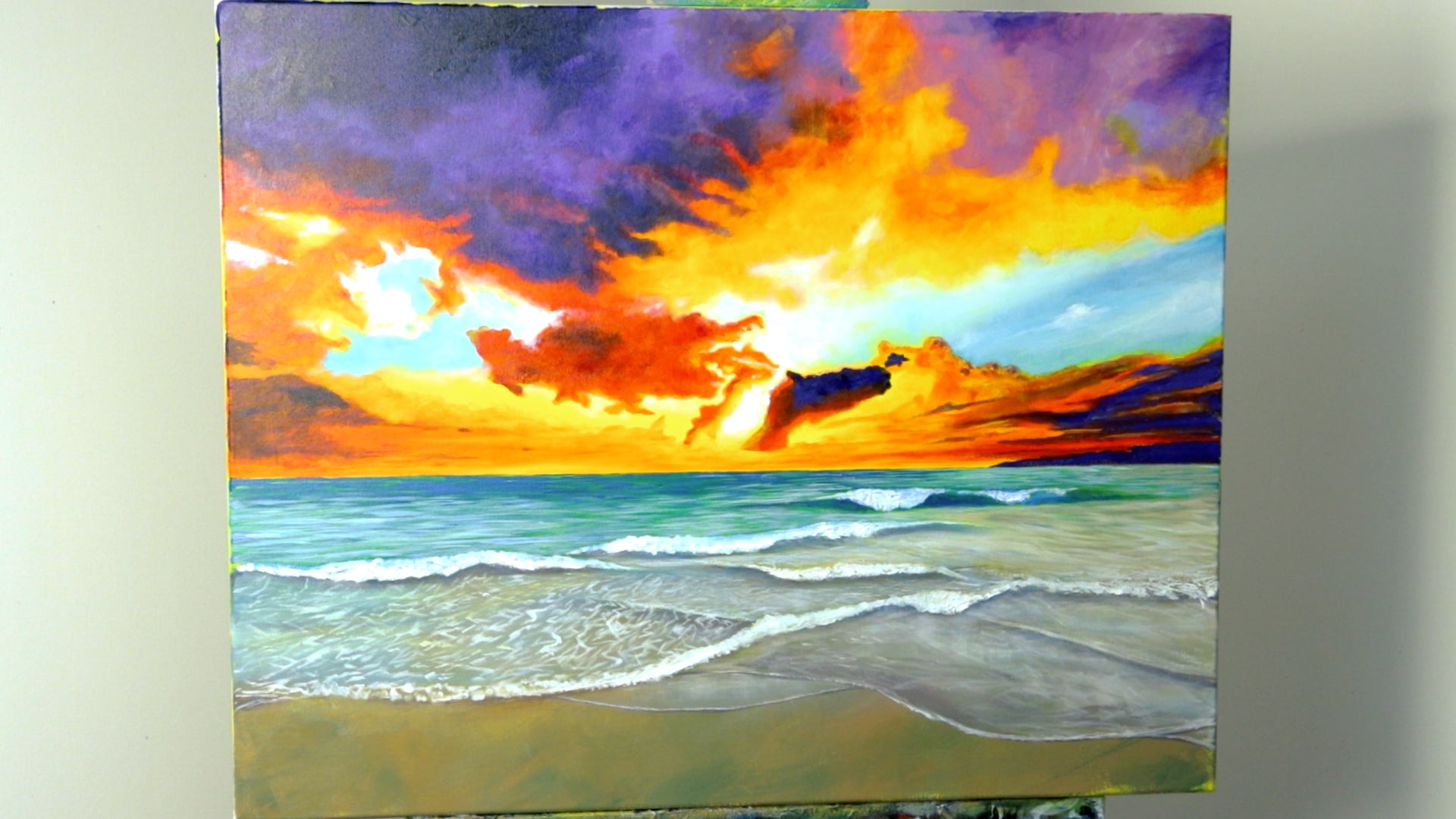 1. Sunset beach painting with brightly coloured sky and tanslucent ocean