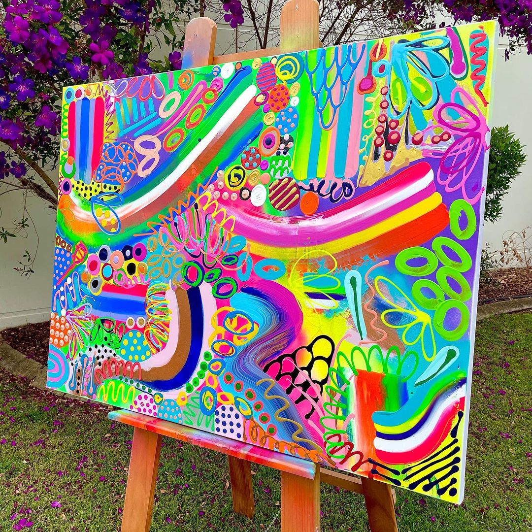 1. Vibrant abstract paining on a large canvas sitting on an easel