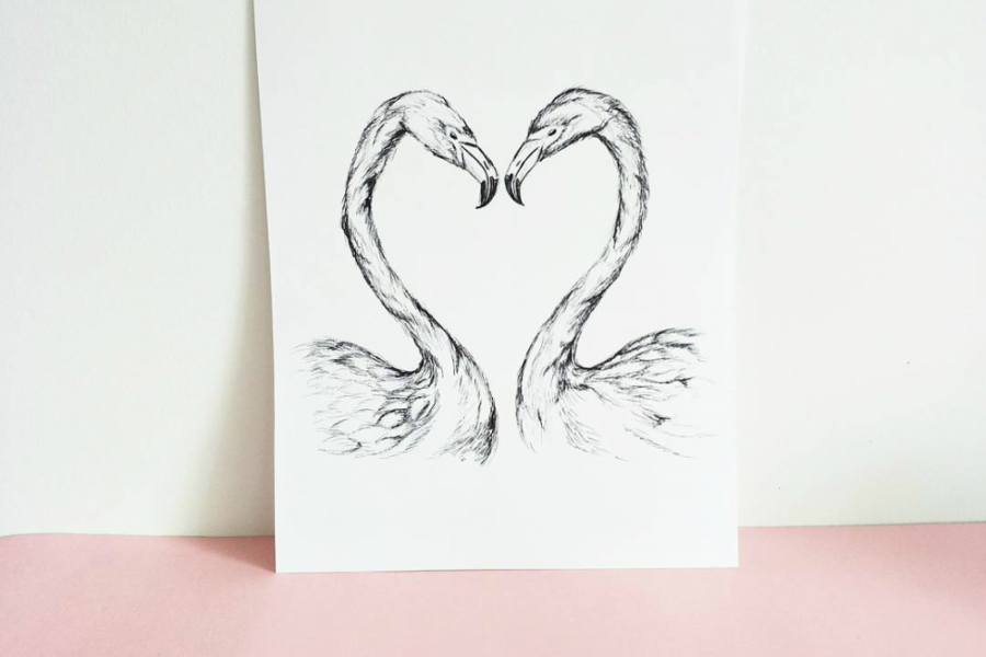 Two flamingos with a heart-shaped beak. 