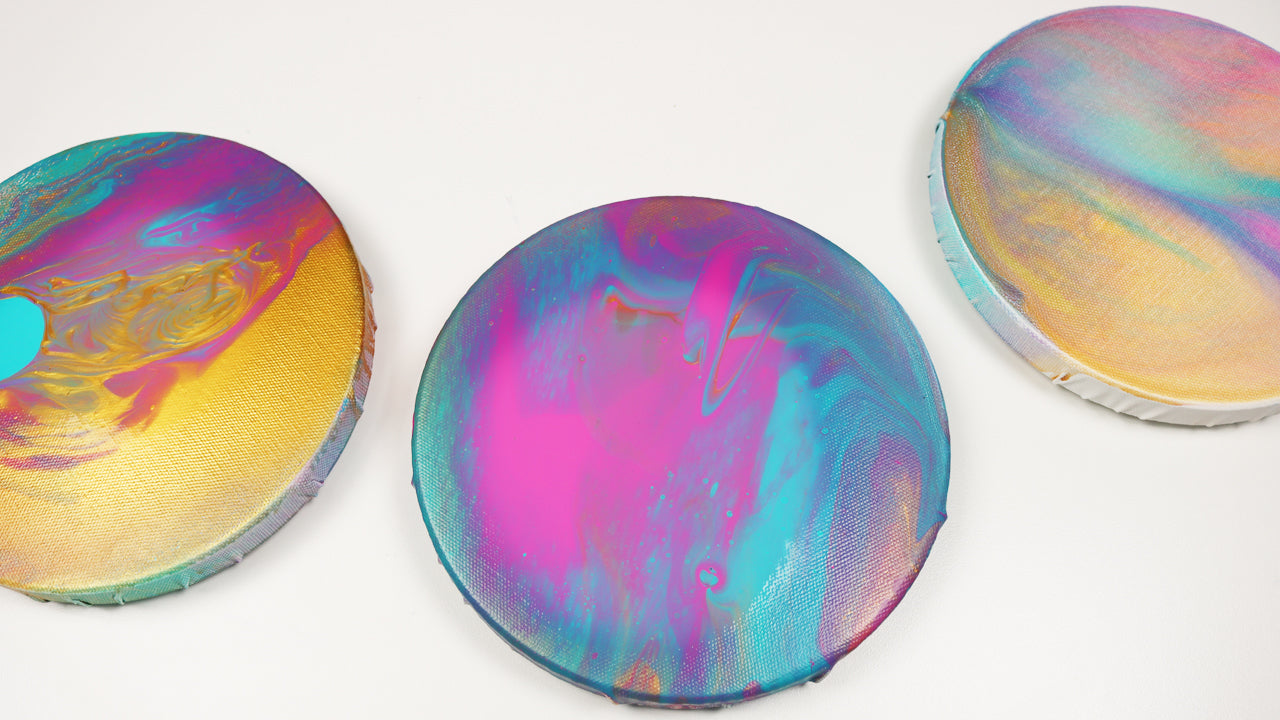 10. Acrylic pour planet paintings on round canvases