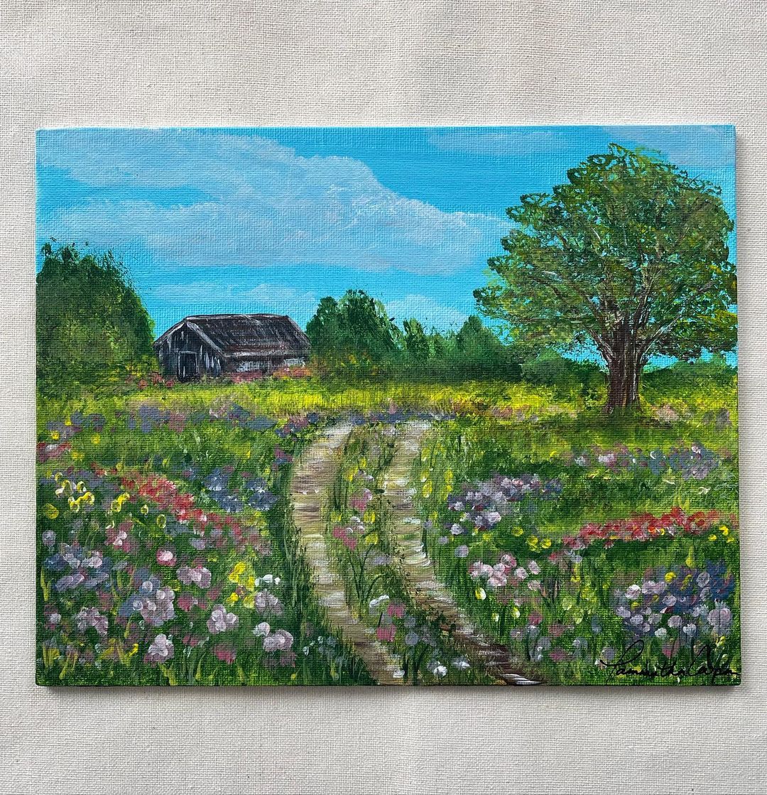 A rural cottage with a bright spring garden painted on canvas.