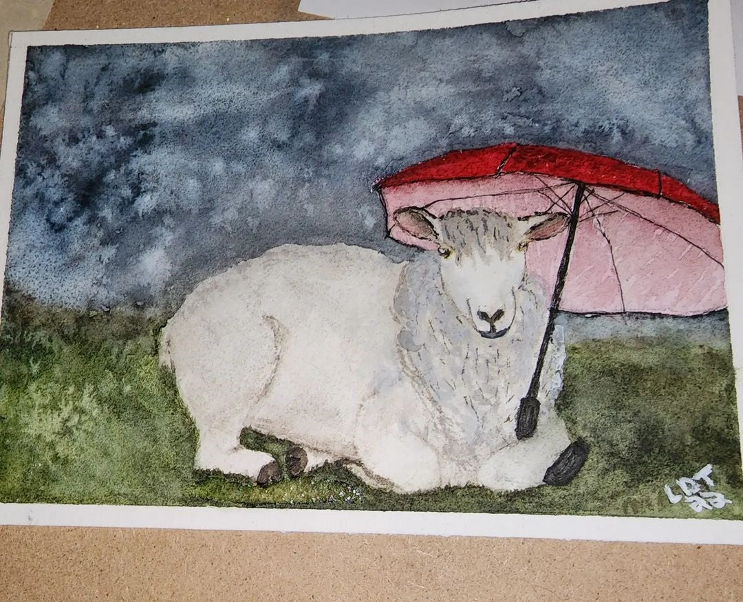 A sheep watercolour painting of a sheep laying on green grass, holding a red umbrella.