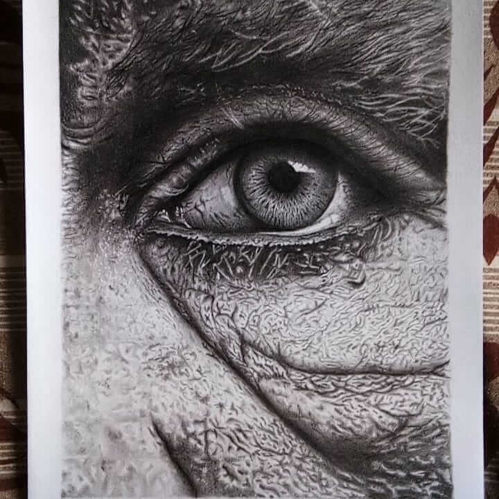 Realistic drawing of an eye close up drawn using charcoal.