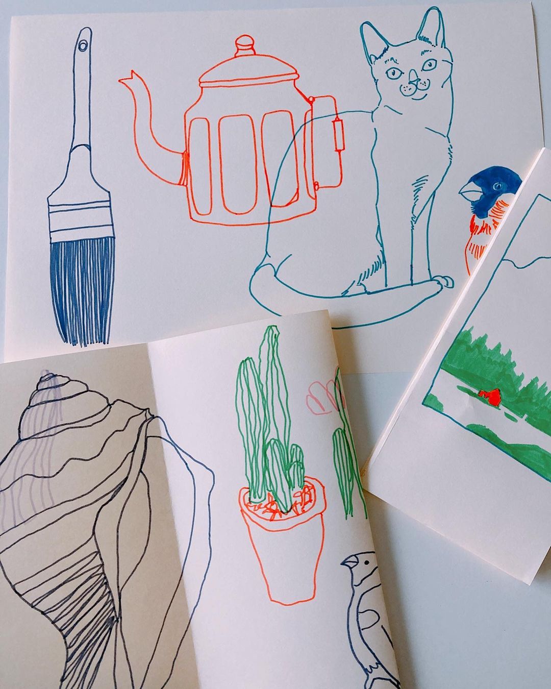 12. Various objects drawn in coloured markers on white paper.