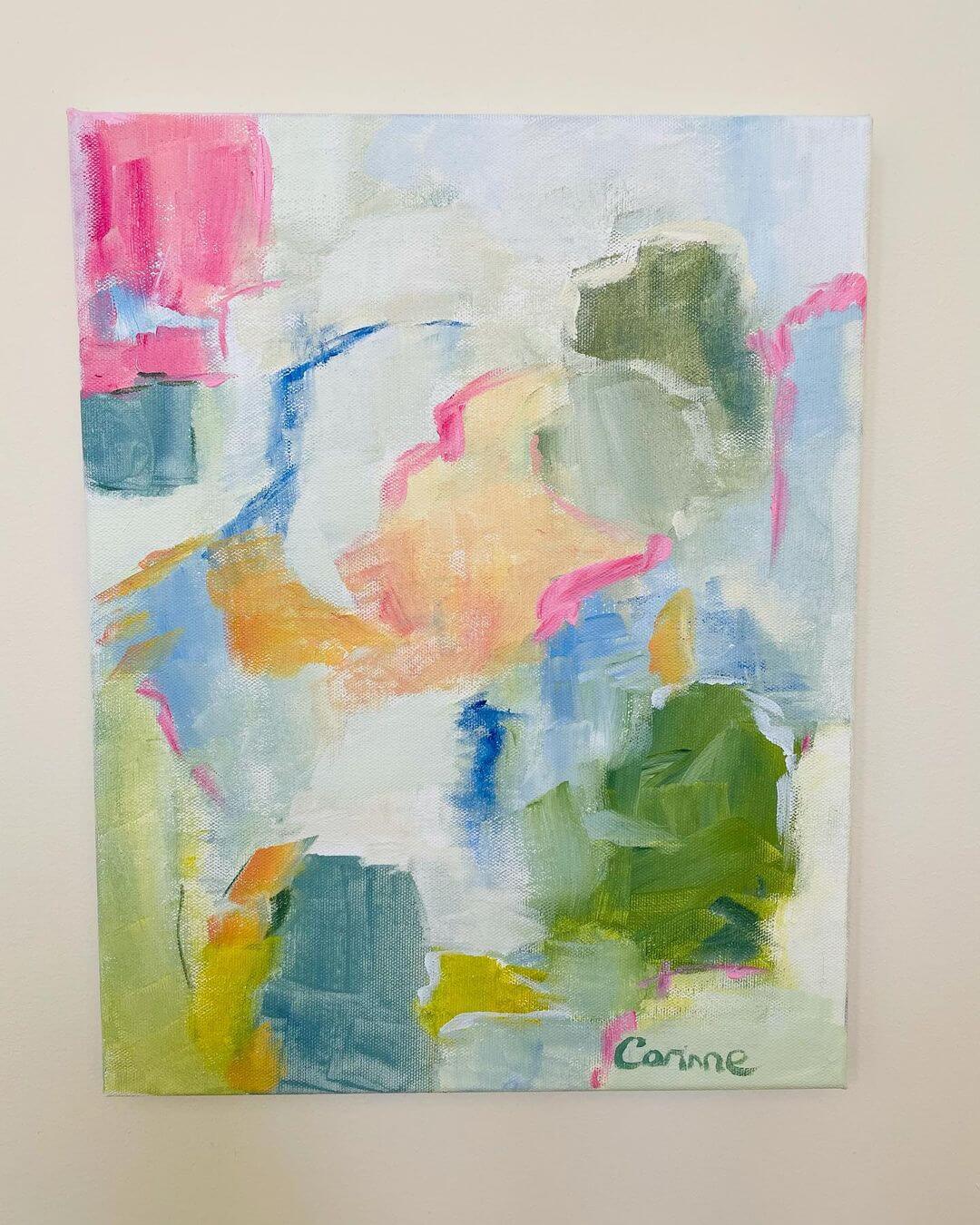 A colourful abstract painting with green, blue and pinks.