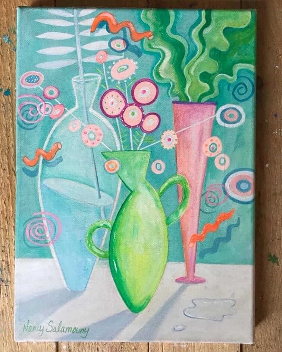 A green, blue and pink whimsical still life.