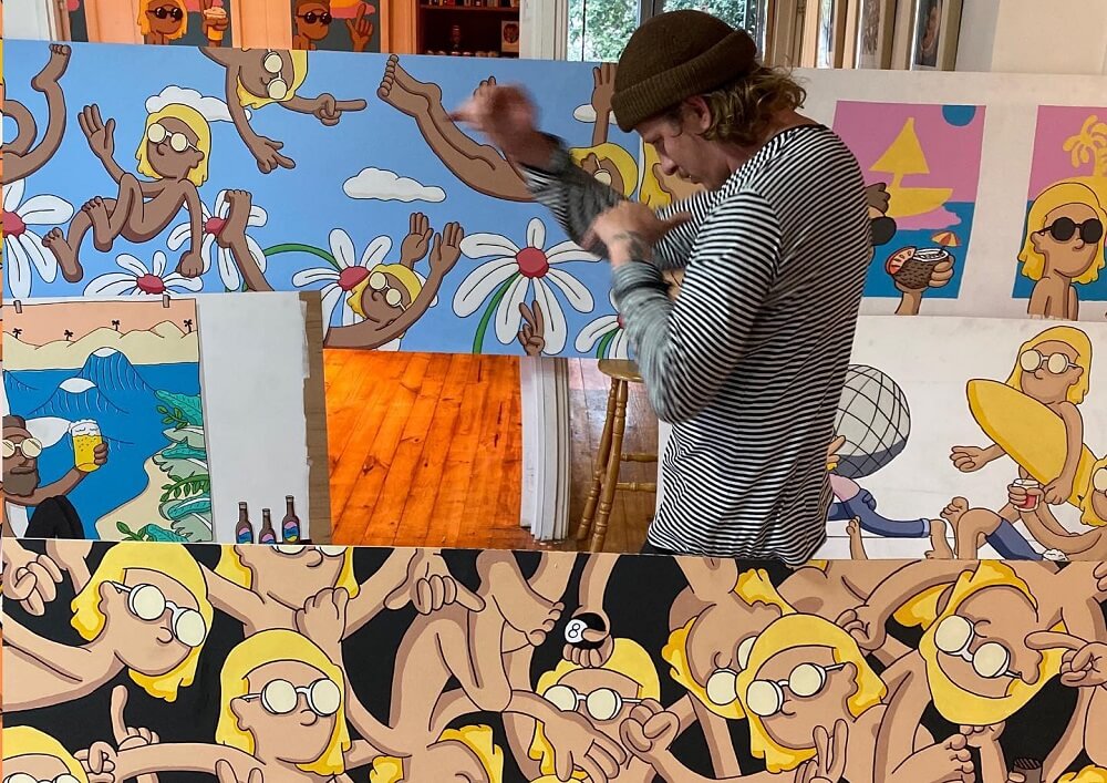 Painter Ben Ross works in motion with cartoons painted on canvas in studio.