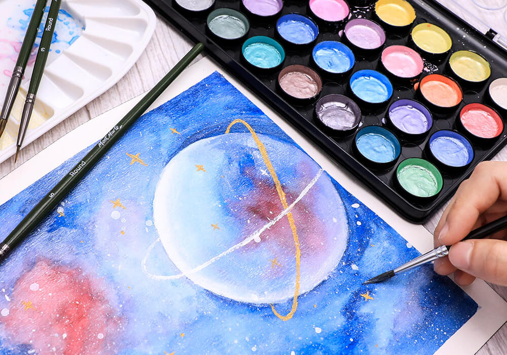 Watercolour painting of space with palette and brush.