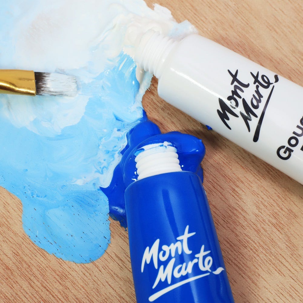 Blue and white gouache squeezed out onto wooden palette.