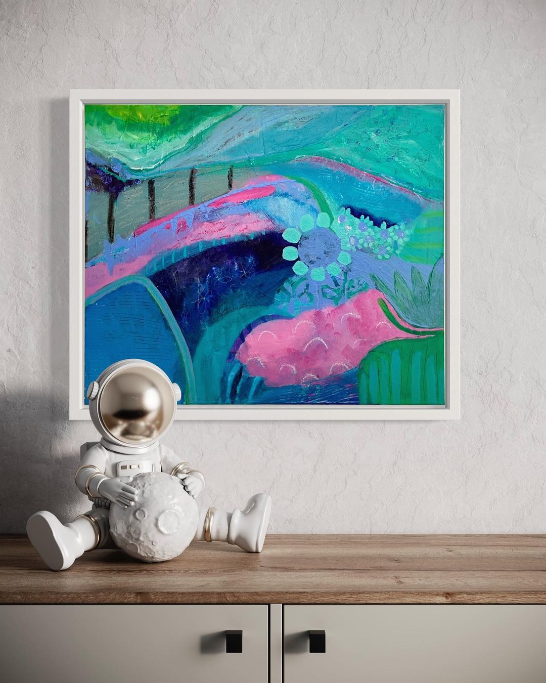 2. Framed natue inspired painting in shades of pink, blue, and green