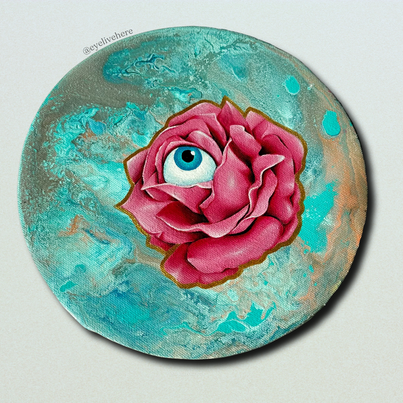 2. @eyelivehere acrylic painting of a blue eye in the centre of a pink rose on a turquoise painted circular canvas