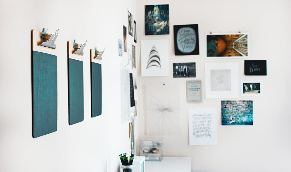 Three DIY chalkboards on a white wall.