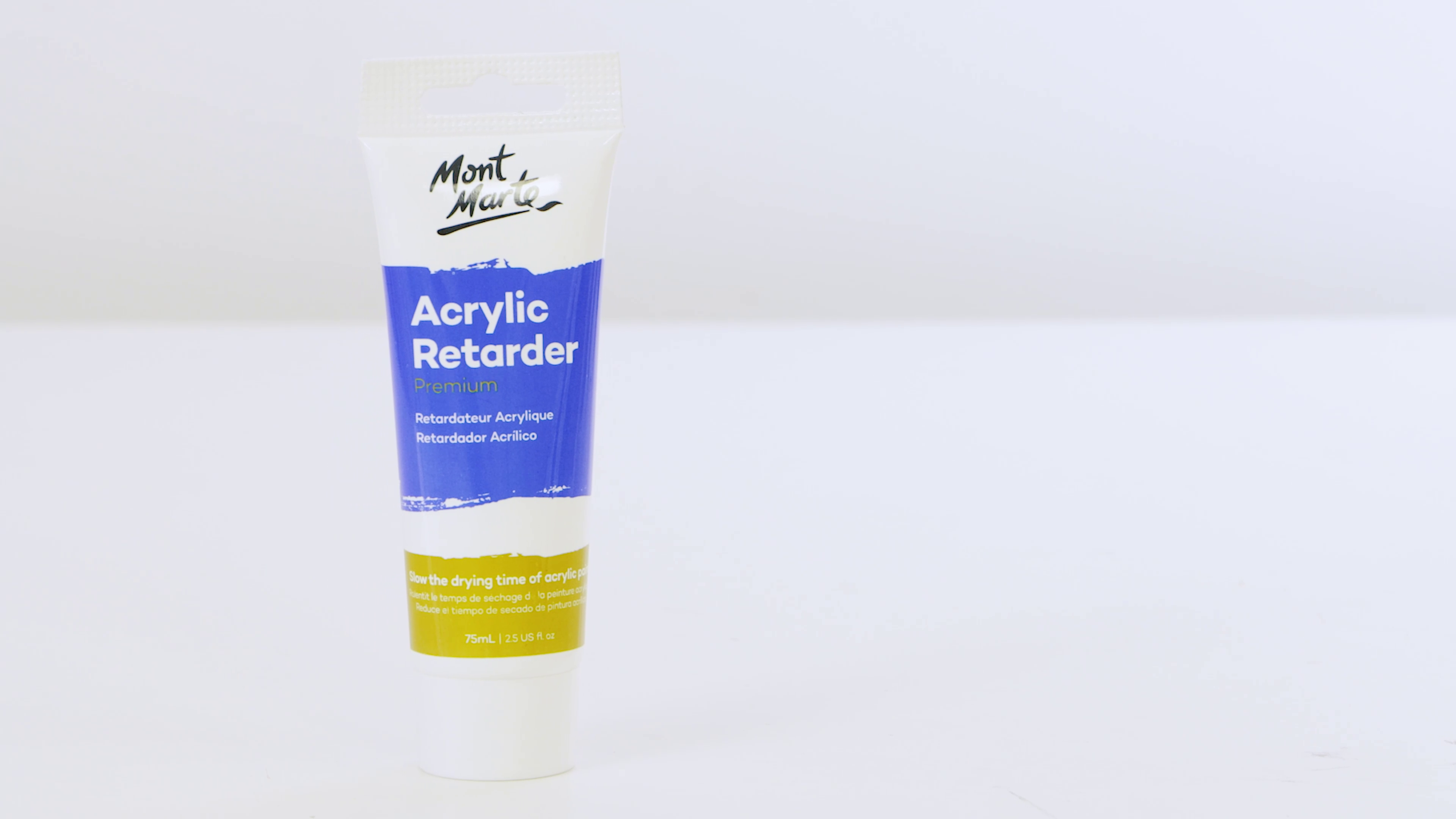 A tube of Mont Marte acrylic retarder with a white background behind.
