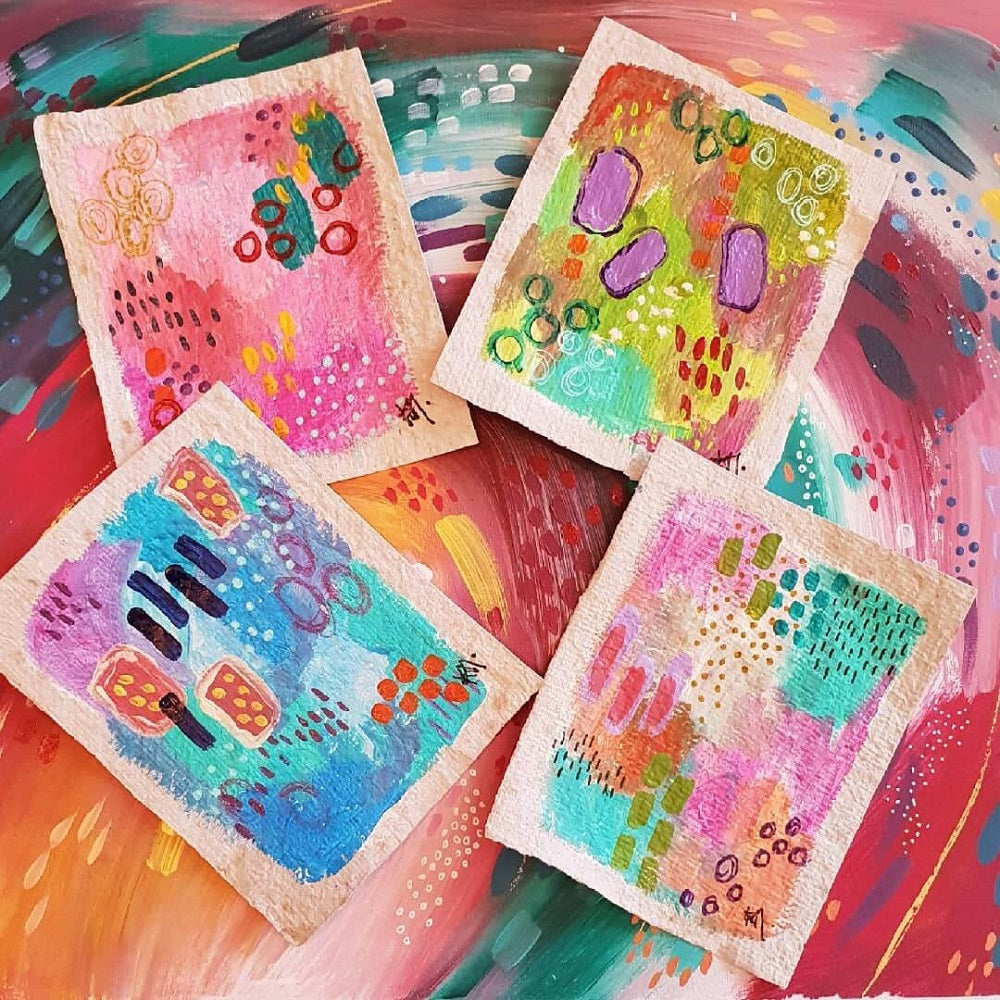 Four coloured abstract artworks all brightly coloured on a rainbow painting.