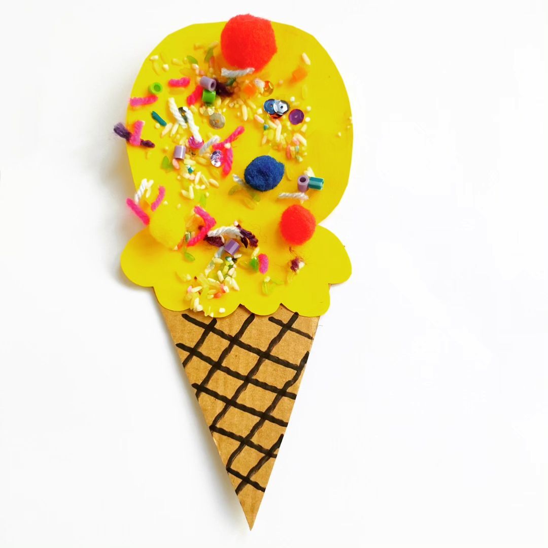 3. @wearethebusybees paper crafted yellow ice cream cone with pretend sprinkles