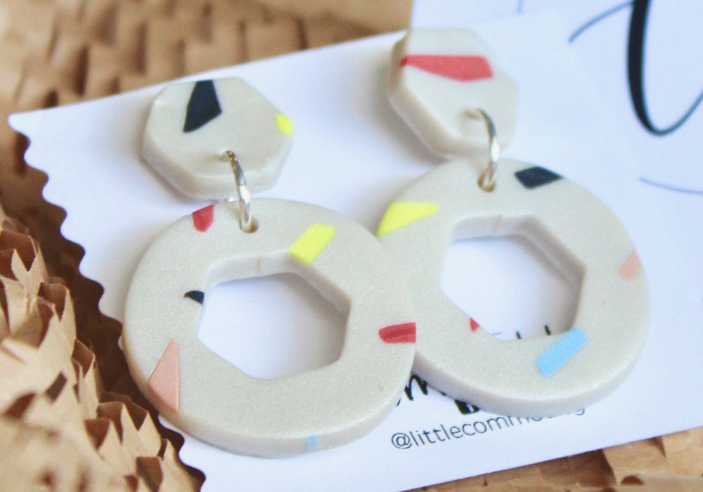A pair of hexagon earrings.