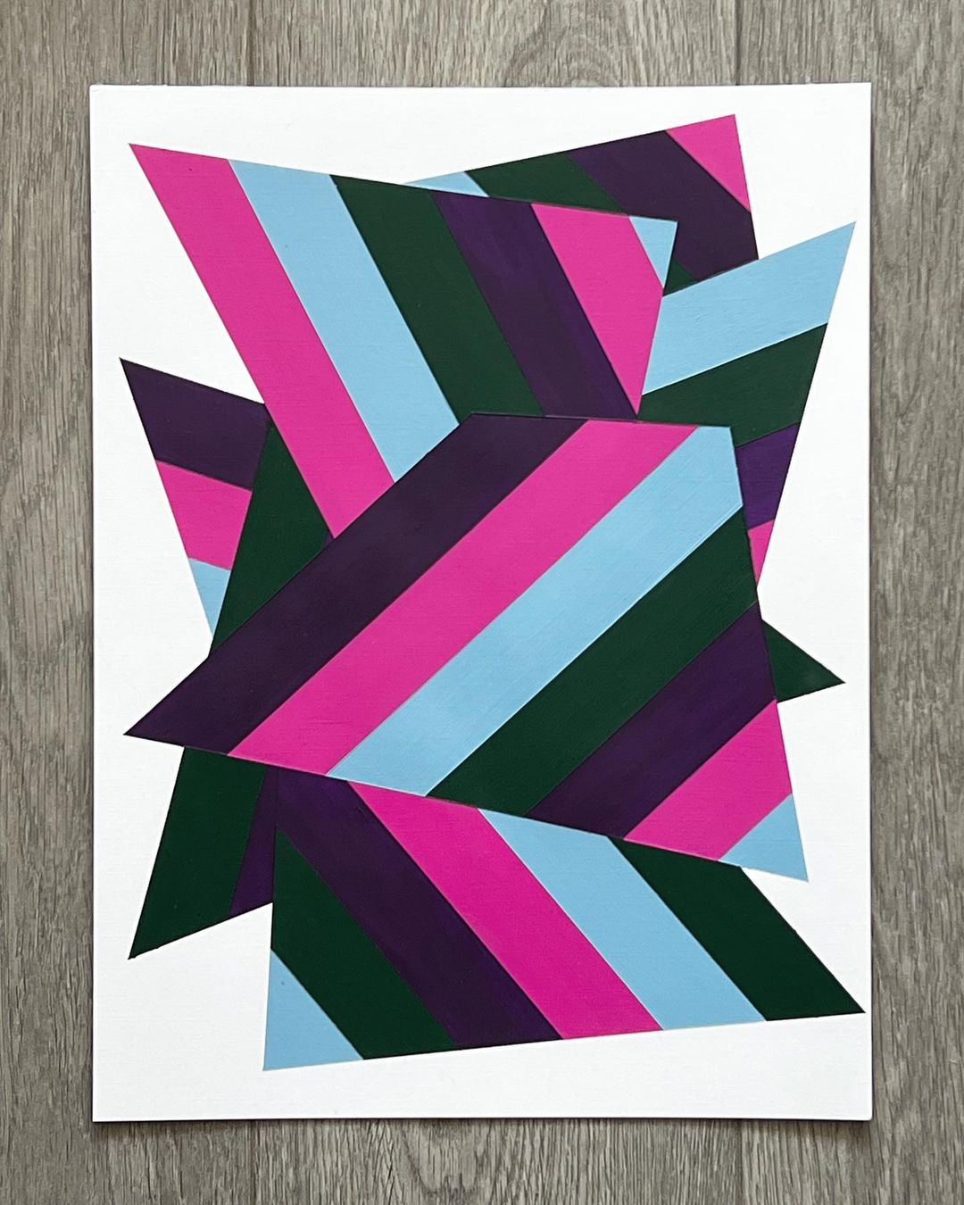 4. @chris_daniels_art abstract geometric artwork with layered, striped trapeziums