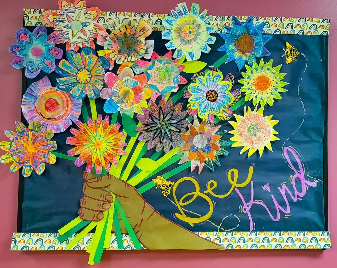 4. @rainbow.heart.artroom crafted artwork bouquet of paper flowers being held by a hand