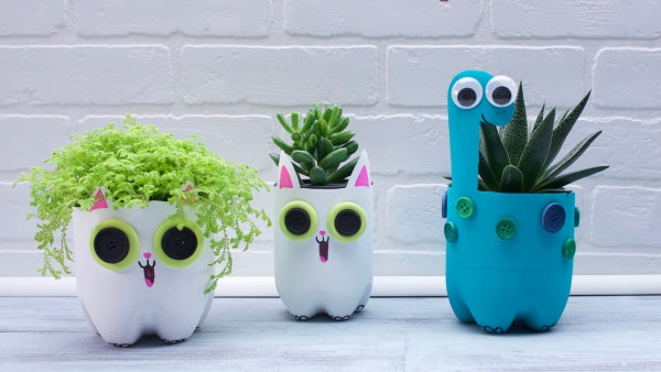 Three cute, recycled plastic bottle planters