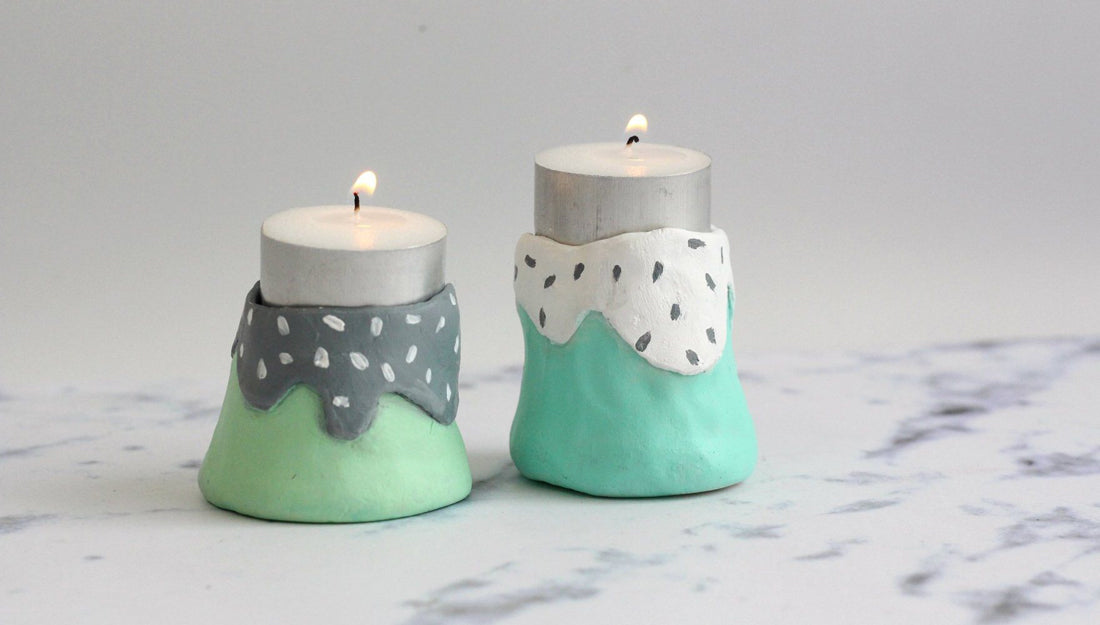 Two air dry clay candle holders.