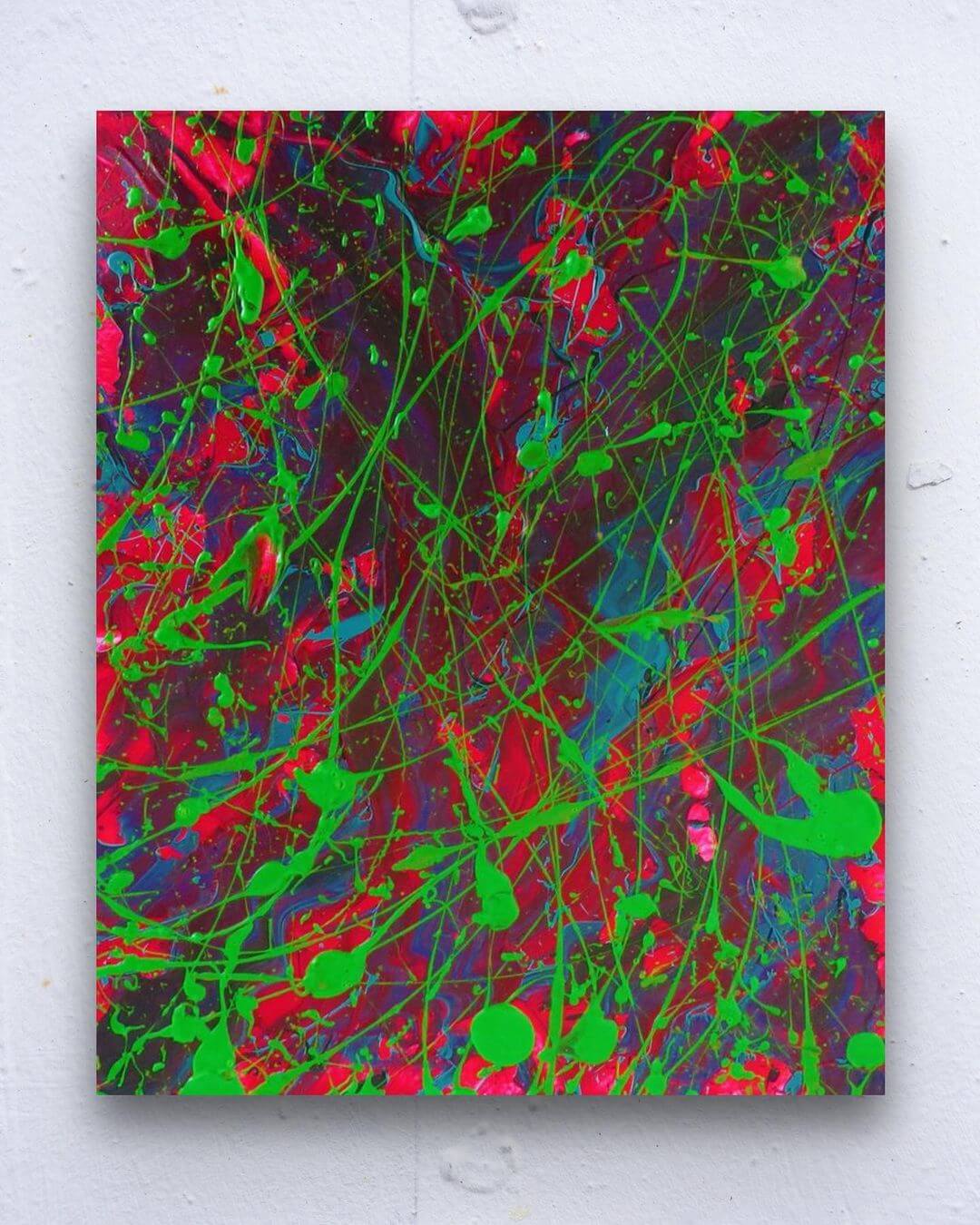 Heavily textured abstract expressionist artwork of red and green.