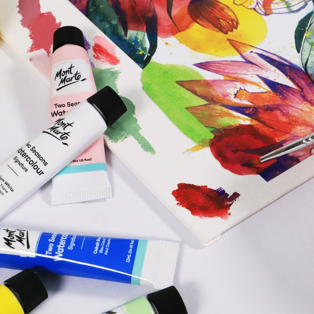 5. Two season watercolour paints being used to paint a floral scene