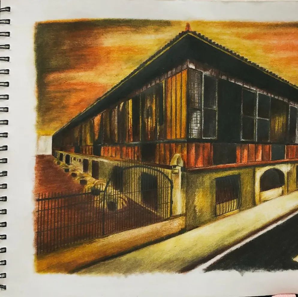 5. @drawwithmau pastel drawing of the corner of a building at sunset