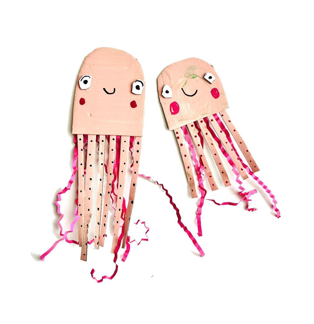 5. @three_busy_boys pink paper craft of two jellyfish with smiling faces