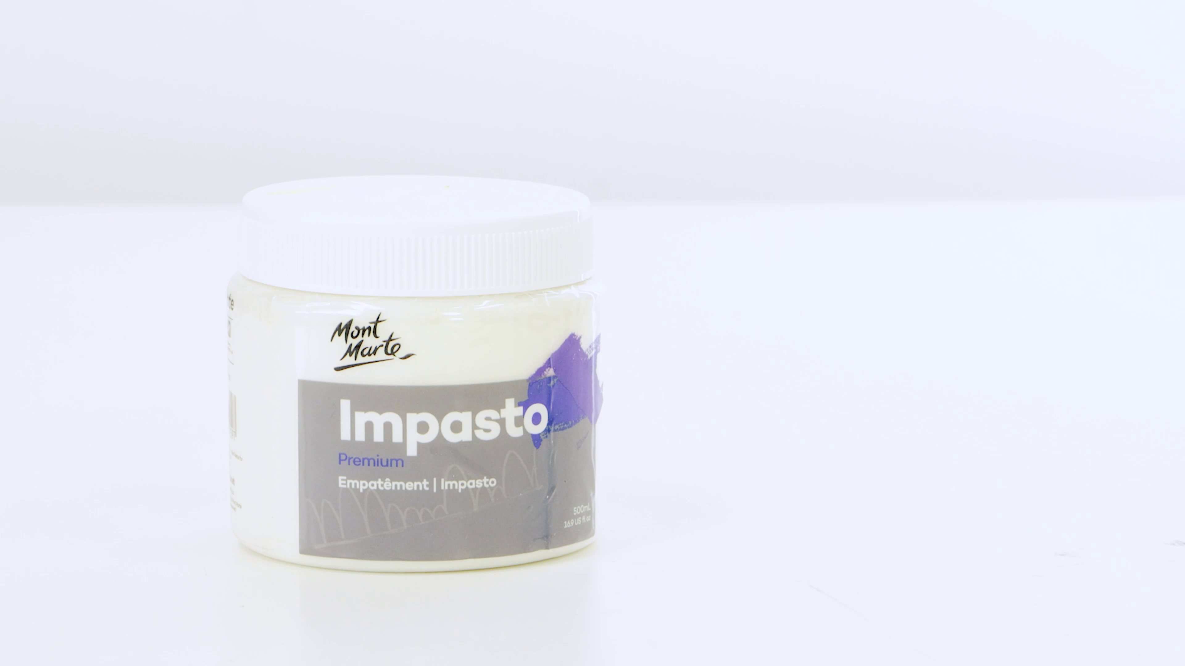 A tub of Mont Marte premium impasto with a white background behind.