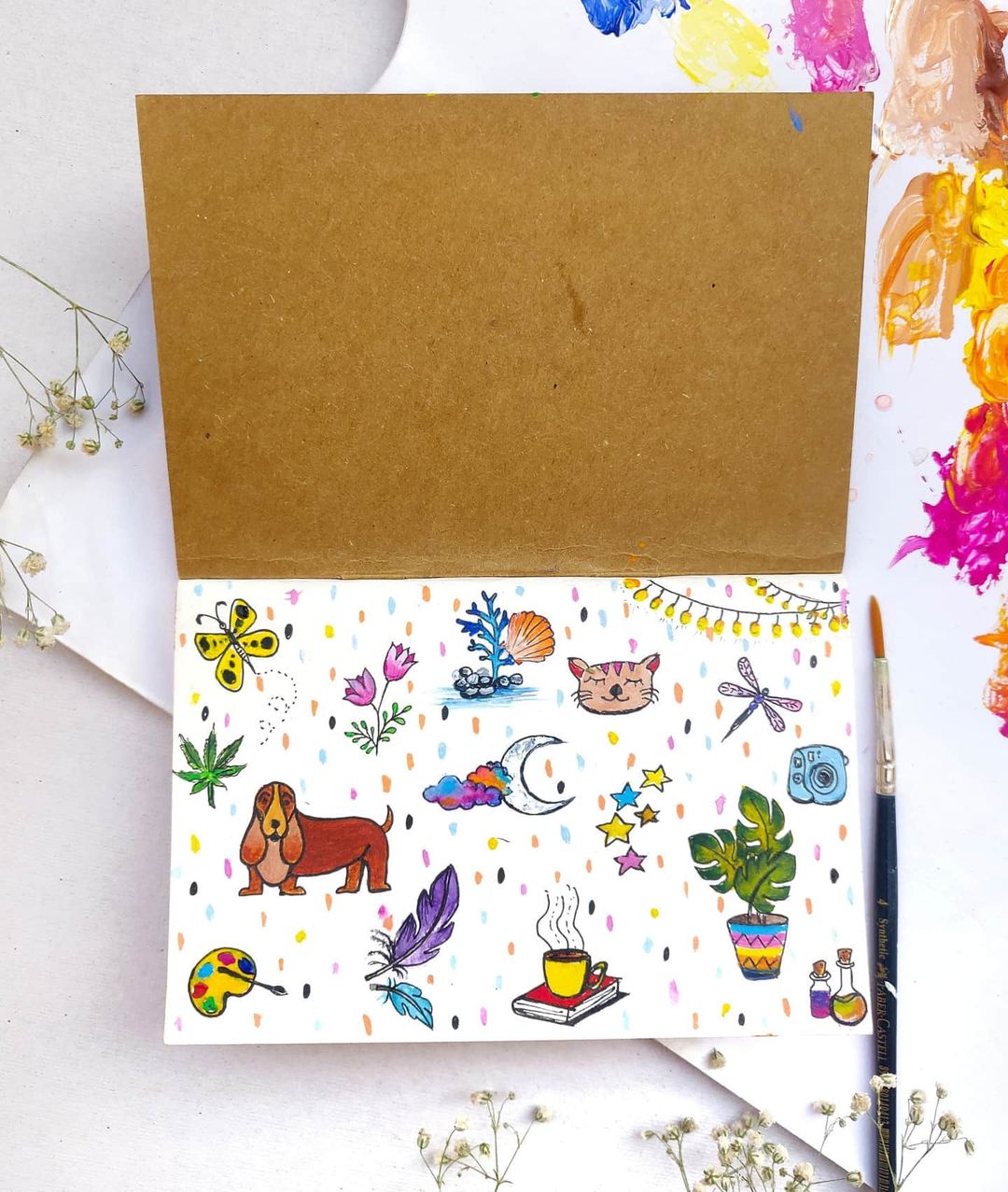 6. Nature and animal drawings in a journal with colourful dotted background