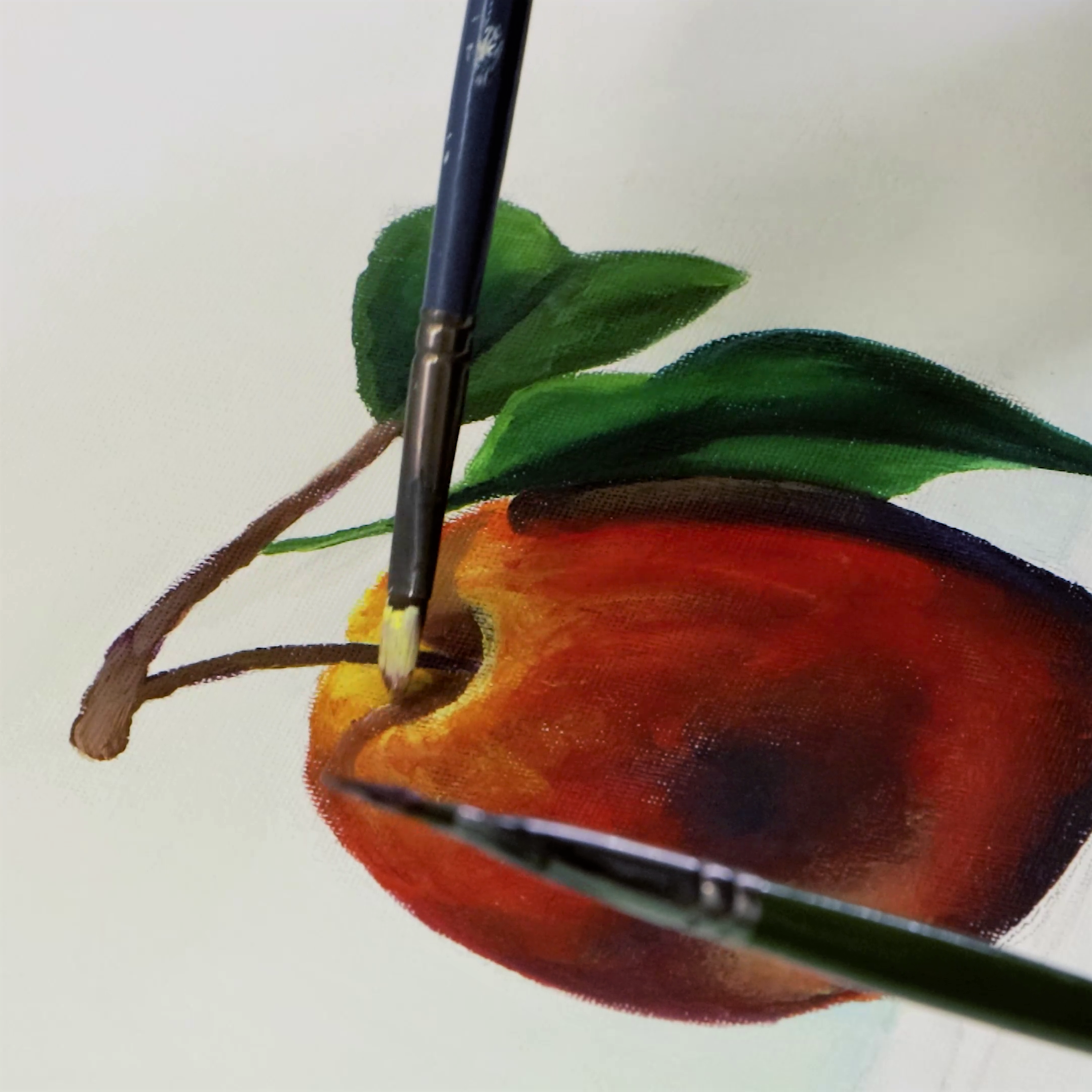 6. Oil painting of an apple with the stem shadow being painted