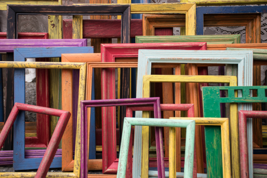 Various coloured frames lying against one another.