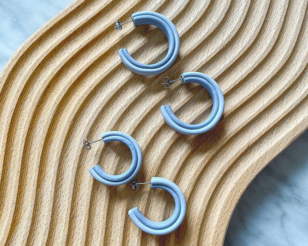 Blue hoops made from polymer clay.