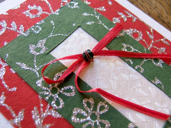 A green and red handmade Christmas card.