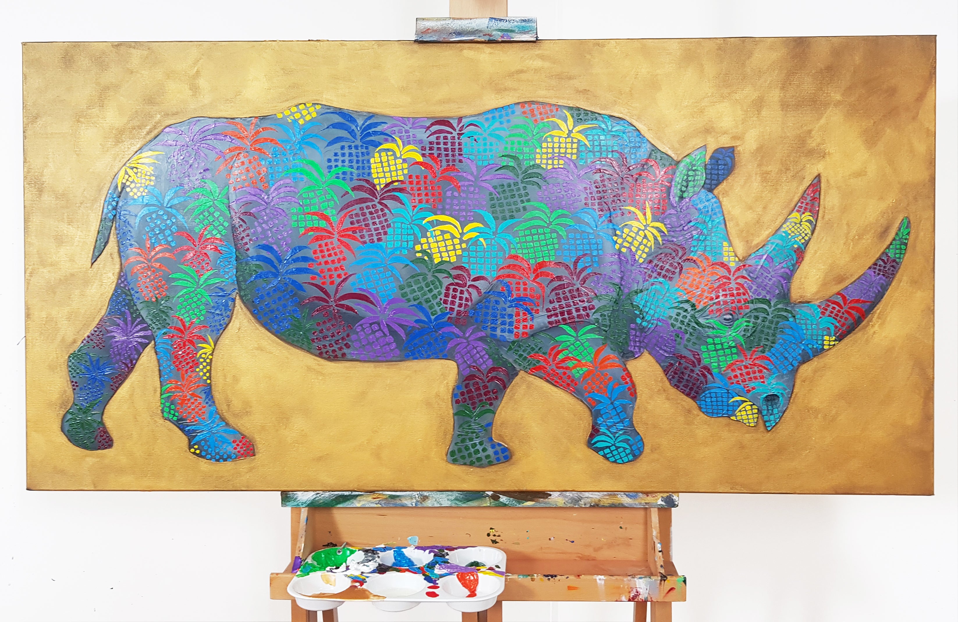 7. Rhino with pineapple pattern on a gold background