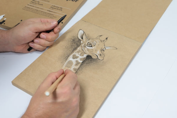 Hand drawing giraffe on kraft paper.
