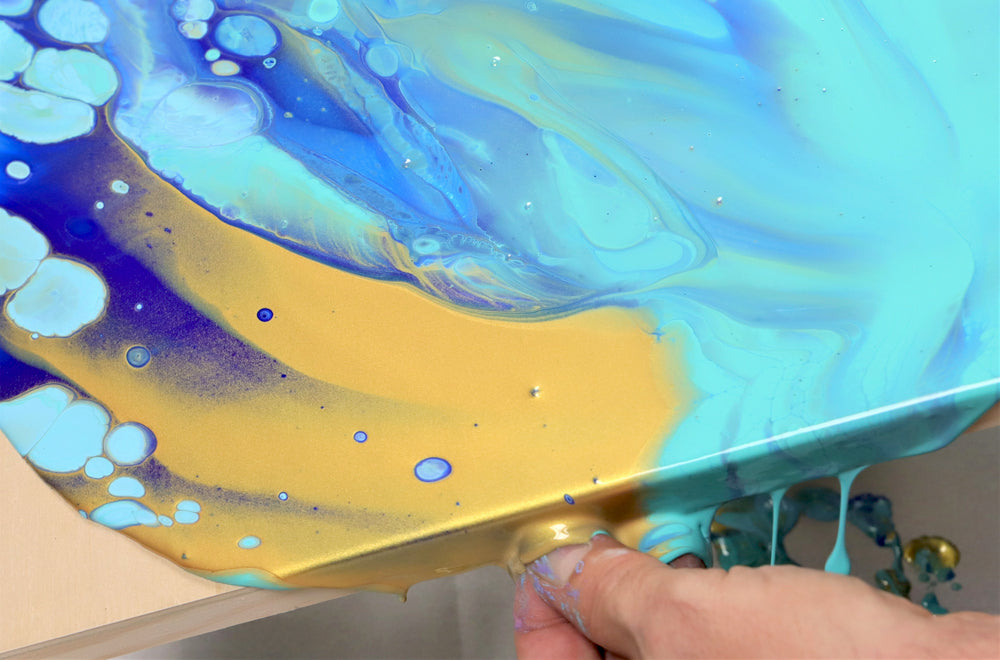 Blue and gold pour painting.